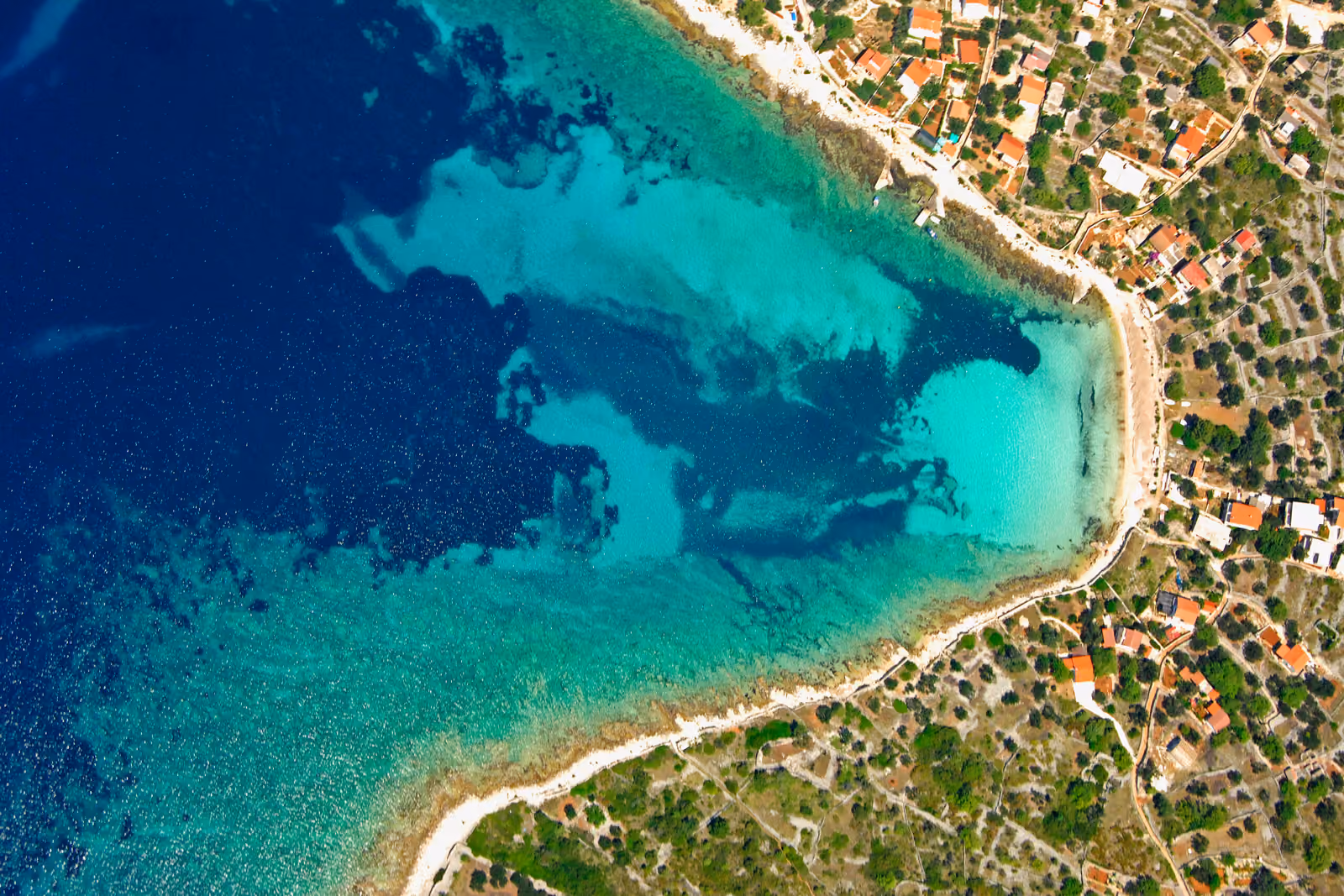 Quiet sandy cove on Drvenik Veli near Trogir